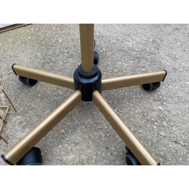 Gold swivel postcard display on casters Height adjustable Brake on two of the five casters Height high position 178cm...