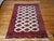 This vintage Turkmen Bokhara area rug, handwoven in the mid-20th century, is a refined and highly desirable example of...
