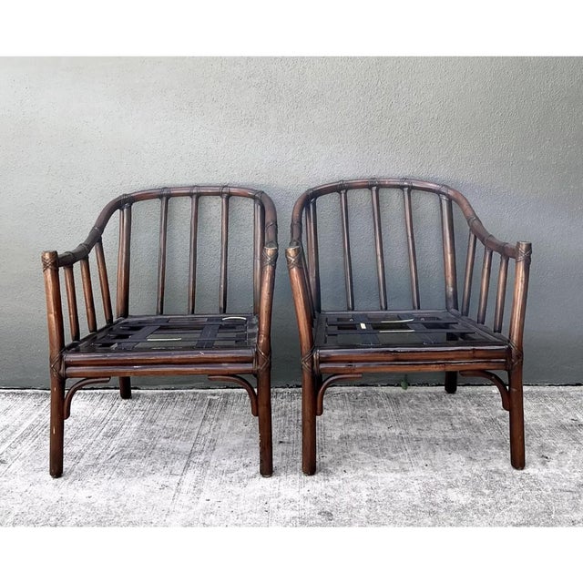 This pair of vintage McGuire rattan lounge chairs showcases the brand's signature blend of relaxed sophistication and...