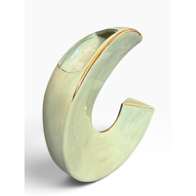 Signed postmodern ceramic crescent vase by McRon, dated 1984. The crescent, or C-form, opens into a full circle broken at...