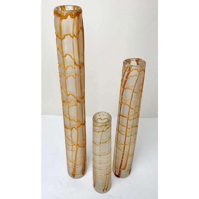 A trio of Modern Kintsugi-style skinny vases, each a unique embodiment of artistry and contemporary design. Crafted in...