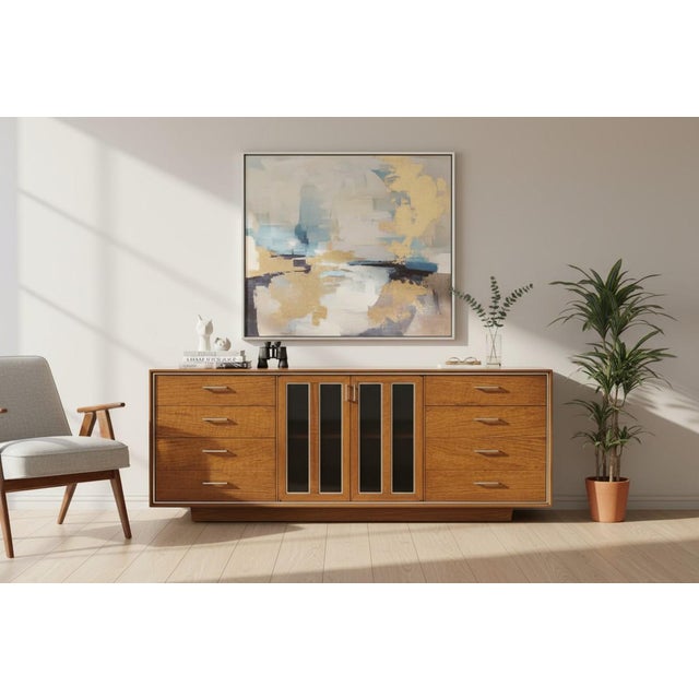 This exceptional Mid-Century Modern walnut credenza showcases the perfect balance of sophisticated design, functionality,...