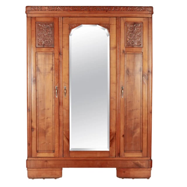 A Monumental French Art Deco Armoire in Carved Cherry with a Floral Relief, Inlaid Mirror & Marble-Topped Nightstand ~ A...
