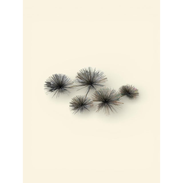 Iconic vintage brass wall sculpture by Curtis Jere, featuring a striking arrangement of hand-welded sea urchin / pom pom...