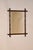 Circa 1900 faux bamboo mirror from France. The frame appears to be made from mahogany and is turned expertly to look like...