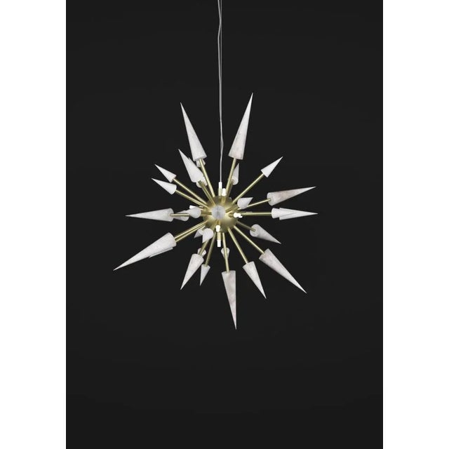Perseo 100 brushed brass metal pendant lamp by alabastro italiano dimensions: ø 100 x h 300 cm. Materials: white alabaster...