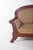 Canapé, upholstered in striped fabric. with a rounded backrest, it is surrounded by a carved frame with a volute design on...