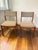 Beautiful pair of Mid-Century Modern dining chairs crafted in warm solid teak, featuring elegant sculptural frames and...