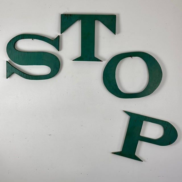 A lovely collection of large vintage wood letters, painted on both sides with a gorgeous teal hue. They are S, T, O, P...