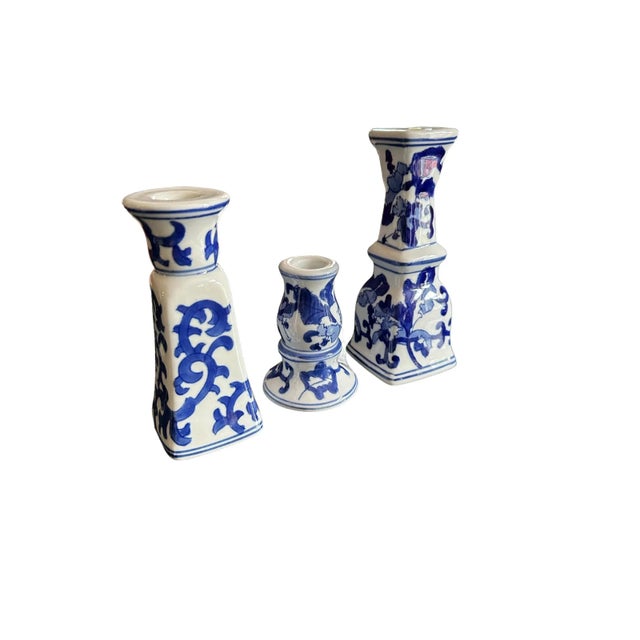 Beautiful set of 3 blue and white chinoiserie Silvestri candlestick holders. This charming vintage set features blue and...