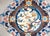 A brilliant mid-20th century Chinese hand-knotted wool rug with a central floral medallion with lotus flowers, bamboo...