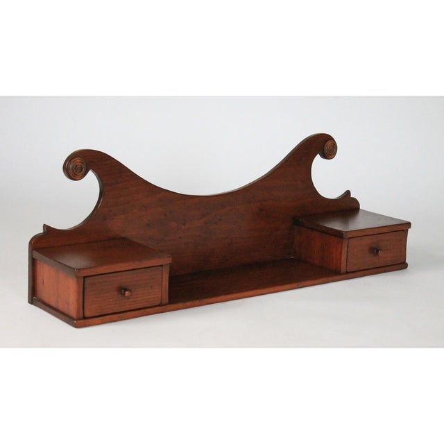 Vintage wood wall shelf with two drawers. No makers mark. Minor age wear. Ready to hang.