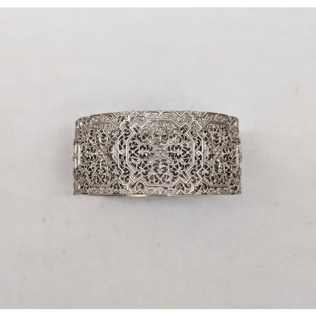 Late 1920s to early 1930s silvertone filigree cuff bracelet with box clasp. Marked "NAPIER" on the tongue of the clasp....