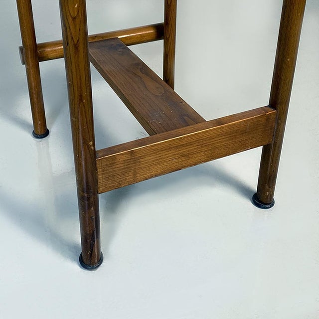 Italian Mid-Century modern wooden structure and faux leather seat high stool, 1970s. Stool with wooden structure with...