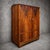 Details English Art Deco design Circa 1930s–1940s Figured walnut veneered doors and drawer fronts Oak framework and plinth...