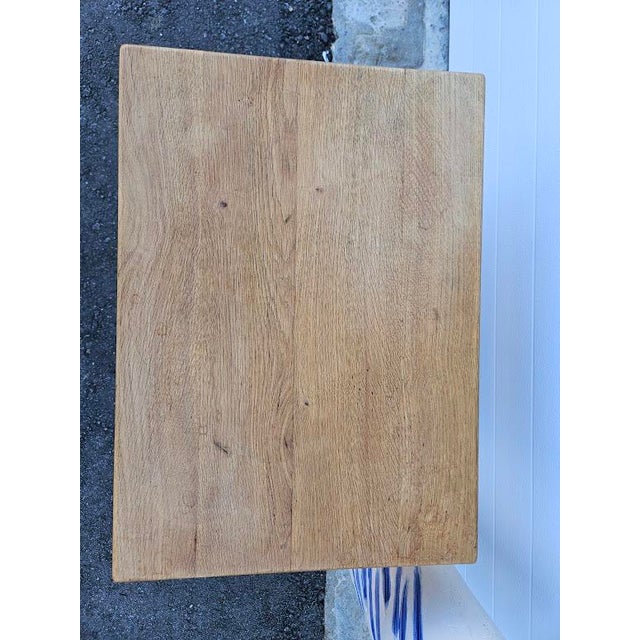 Scandinavian oak side table in the manner of Henning (Henry) Kjaernulf, circa 1970s. The piece is in good condition with...