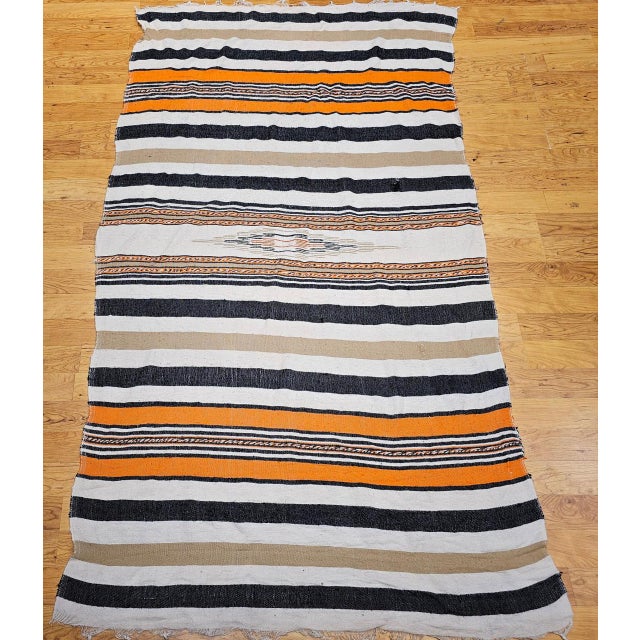 This vintage Southwestern Serape blanket from the third quarter of the 20th century showcases the timeless beauty of...