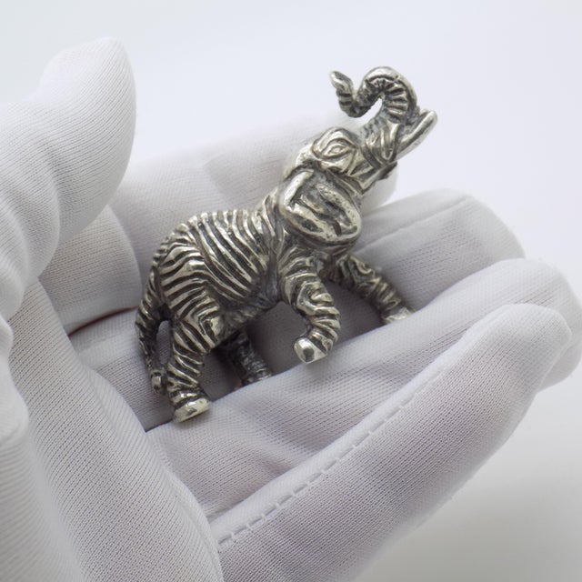 A heavy solid elephant figurine, handcrafted in Italy during the 1950s to 1960s. This vintage miniature is made in genuine...