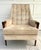 Here is a wonderful, high back lounge chair from the mid-century featuring beautiful wood arms and tufted upholstery. The...