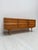 Beautiful german mid-century sideboard from the 1960s, crafted in walnut and characterized by its clean lines, warm wood...