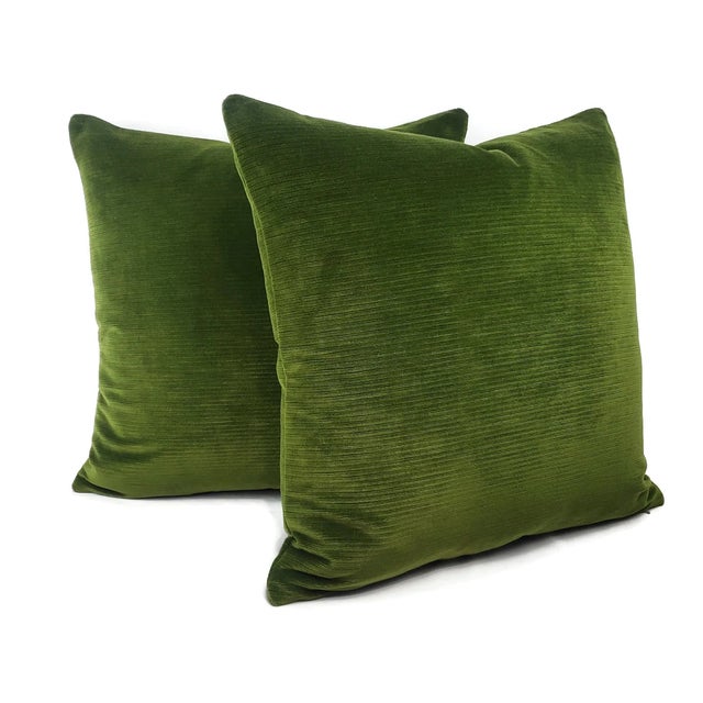 This is a rectangular lumbar pillow cover featuring a rich moss green velvet fabric. The velvet has a subtle texture, due...