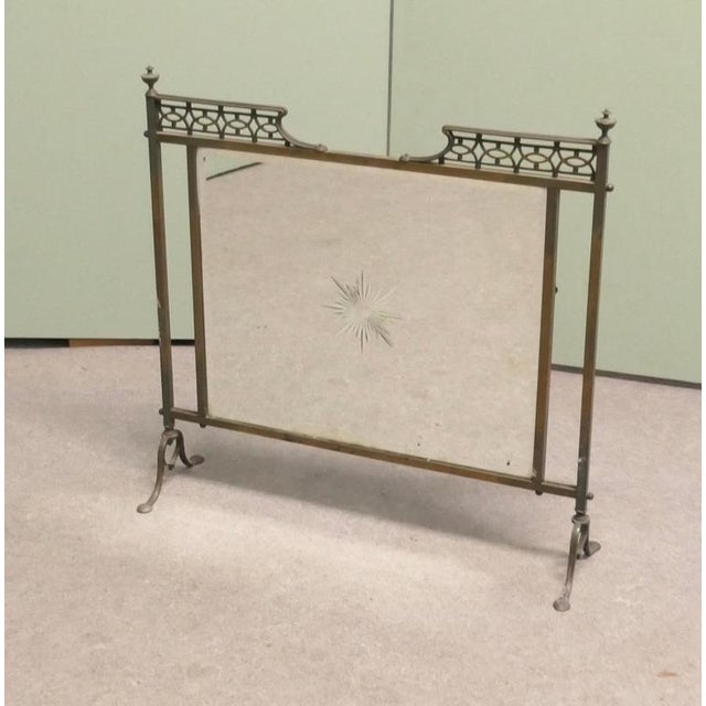 A Victorian Arts and Crafts Brass Mirror Fire Screen with Etched Sunburst This is a very decorative Fire Screen it has a...