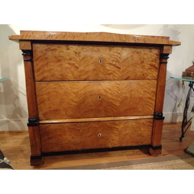 Handsome period Biedermeier three-drawer chest or commode with beautiful patina retaining the original locks and key. This...