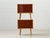 This elegant bedside table embodies the clean, functional design language of the 1950s and impresses with its refined...