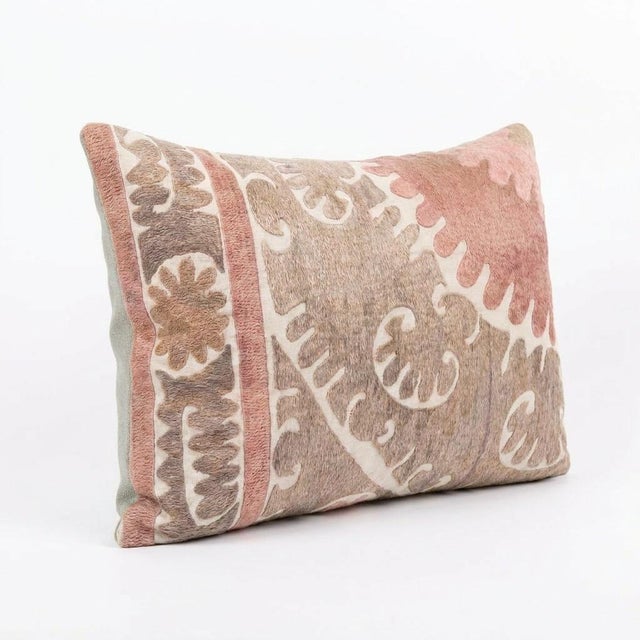 This beautiful 16'' x 24'' hand-embroidered Suzani pillow cover was made from authentic Uzbek cotton fabric. The intricate...