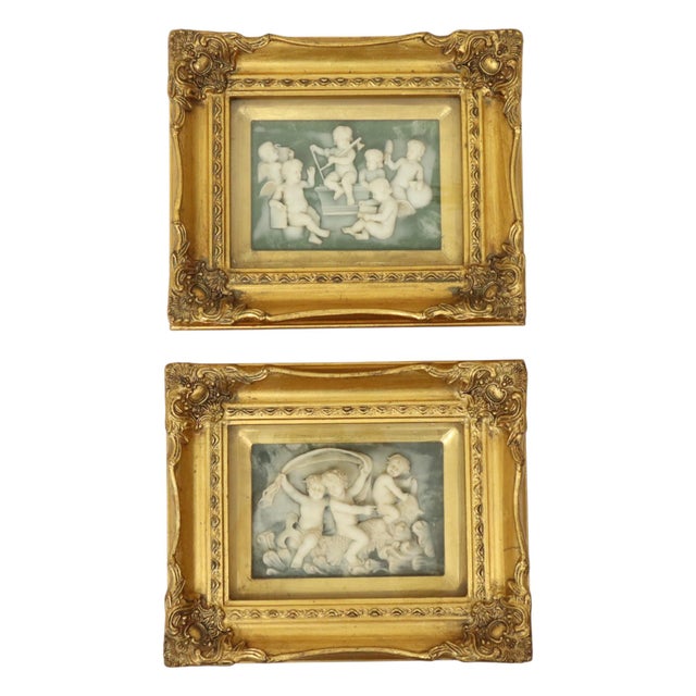 Set of 2 framed plaques made of alabaster powder and resin, framed in a classic Baroque-style frame gilded with gold leaf,...