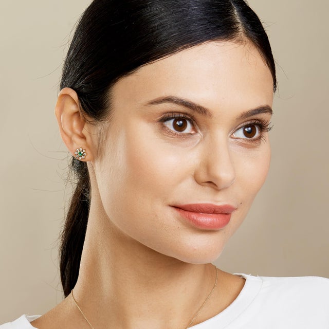 Created in 18kyg Diamonds 0.70 cts approx Emeralds 0.20 cts Draw attention with these stunning Candy Blue Topaz and...