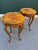 An exceptional pair of 20th-century French Louis XV occasional tables featuring richly figured yew and mahogany...