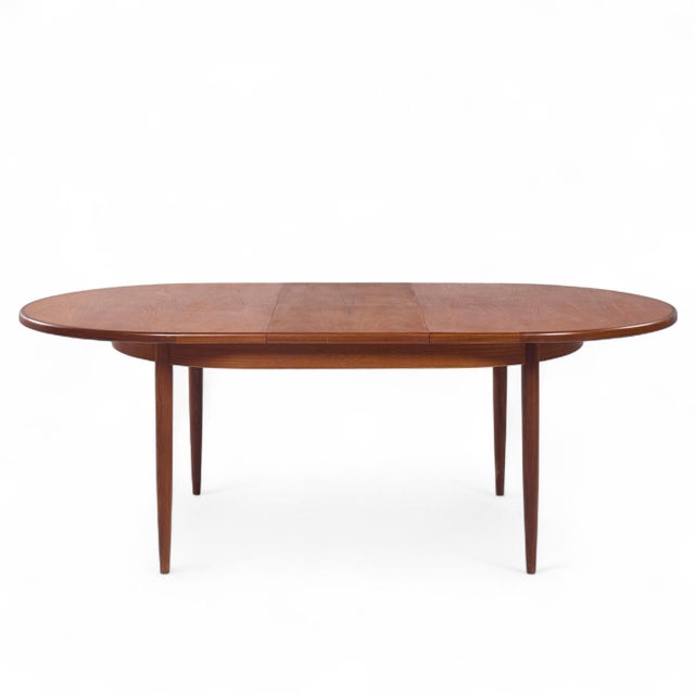 G Plan Mid Century Teak Hidden Leaf Expanding Dining Table This table measures: 64 wide x 44 deep x 28.75 inches high,...