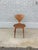 Iconic mid-century modern side chair Attributed to Norman Cherner, circa 1950s. This sculptural chair exemplifies...