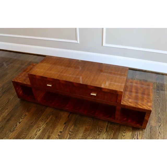 This gorgeous Kravet Walnut coffee table is in great condition. Two tiered, with three cubbies and two drawers. It has a...
