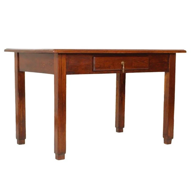 This country rustic Art Deco table with a drawer is made of solid oak.
