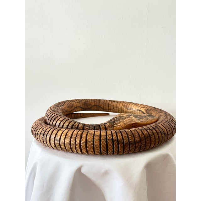 Charming vintage articulated snake sculpture, hand-carved in wood and designed to realistically mimic the natural movement...