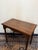 A charming victorian occasional or hall table dating to the late 19th century, featuring a clean rectangular top and...