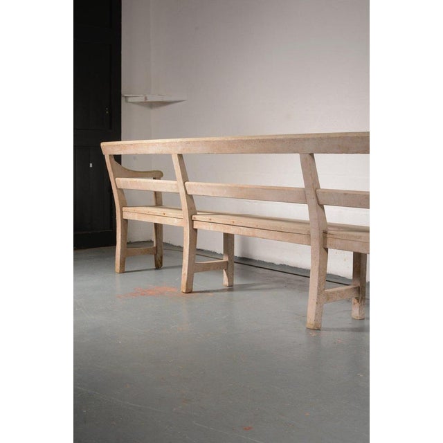 An exceptional 19th century bench, in the most fantastic untouched original off white paint, of restrained form with an...