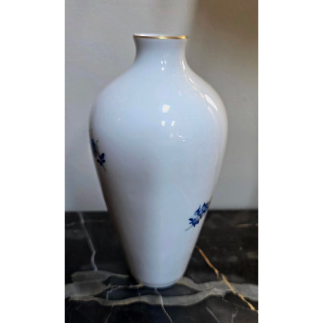The Miessen 50155 hand painted Vase is a decorative collectible item designed to hold flowers or serve as a standalone...