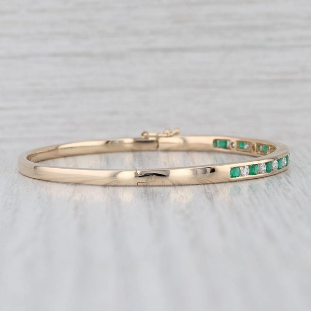 Gemstone Information: - Natural Emeralds - Total Carats - 0.70ctw Cut - Round Color - Green Treatment - Oiling - Natural...