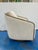 Stylish Swivel chair with wood trim, cream micro chenille fabric. Showroom floor sample.