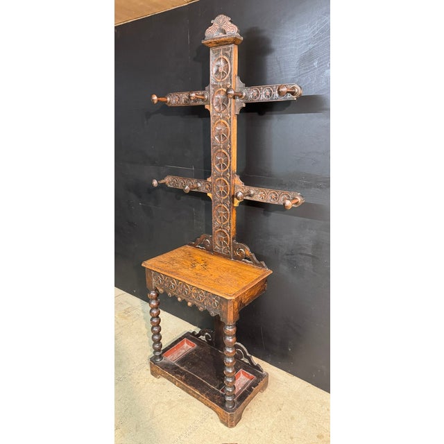 A lovely carved Oak Hallstand or Hallstree the base has a single drawer with original drop trays