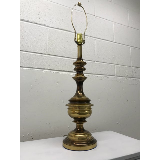 Vintage aged-brass bulbous table lamp, switch on the base, manner of Stiffel, circa mid twentieth century.