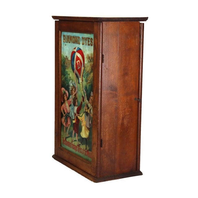 Green Antique Wells & Richardson Co. Diamond Dye Oak & Embossed Country Store Cabinet For Sale - Image 8 of 15