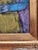 Acrylic painting with gold frame and purple background depicting an abstract person with a glass. Shawn Savage, a noted...