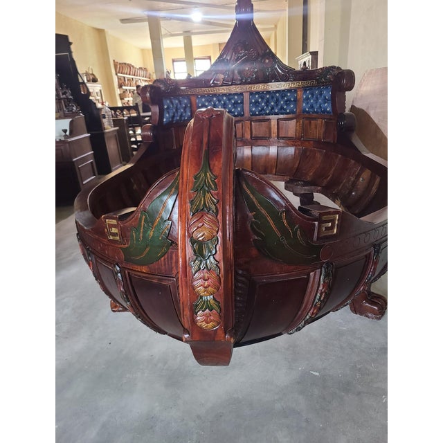 An exceptional and highly impressive monumental 19th century “lit bateau” bed, executed in the grand tradition of the...