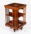 This an exquisite antique edwardian revolving bookcase, attributed to the renowned retailer and cabinet maker, maple & co,...