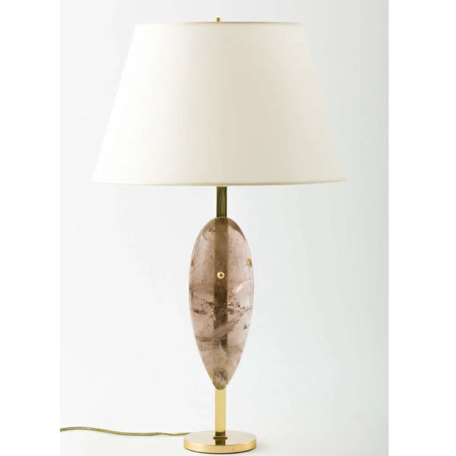 Pair of brass table lamps featuring teardrop-shaped smoky quartz crystal. These are natural elements and so the...