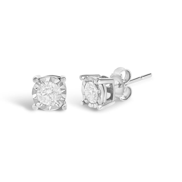 Celebrate any occasion with these classic shimmering diamond stud earrings. Fashioned in .925 sterling silver, each...